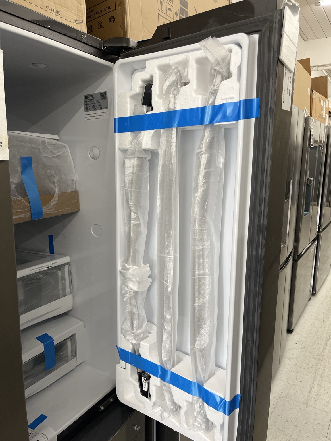 Actual GE GWE23GMNES 23.1 Cu. Ft. Counter-Depth French-Door Refrigerator in the MD Appliances showroom