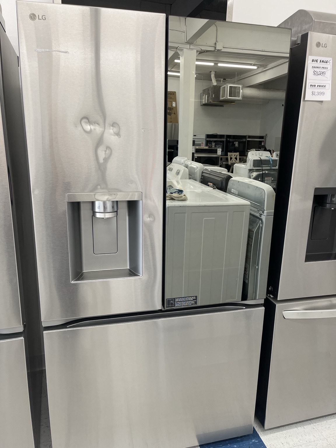 Actual LG LRYKC2606S 26 Cu. Ft. Counter-Depth MAX French-Door Refrigerator with Mirror InstaView — Unit 2 in the MD Appliances showroom
