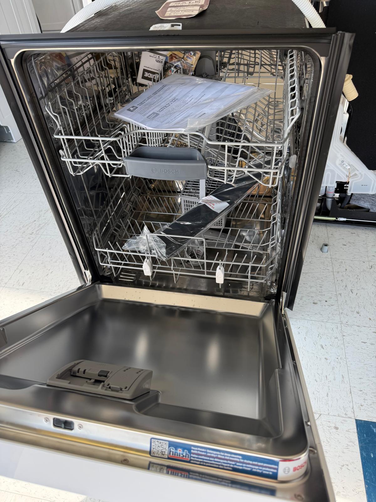 Actual Bosch 100 Series 24-Inch Front Control Dishwasher in White – Model SHE41CM2N in the MD Appliances showroom